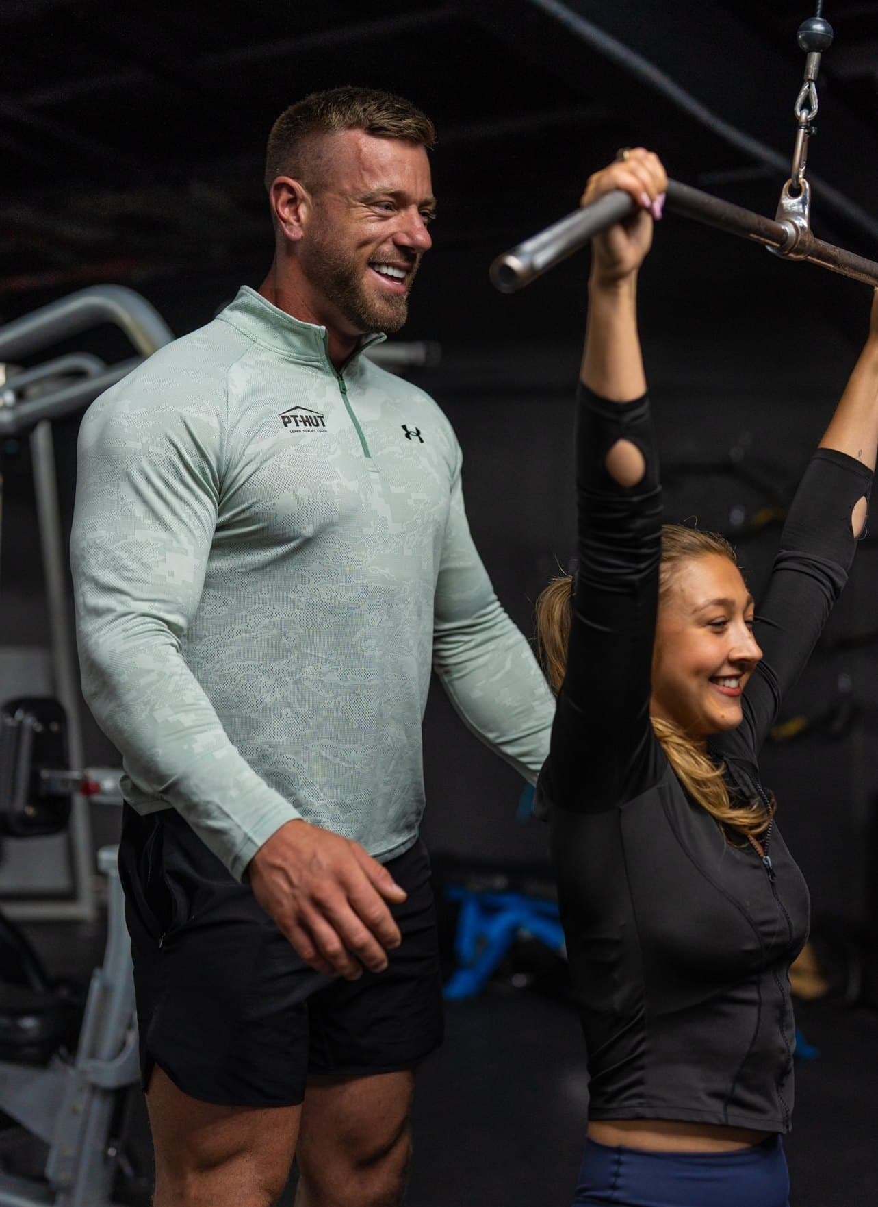 Clinton Coffey watching a client through a lat pulldown on an assessment day